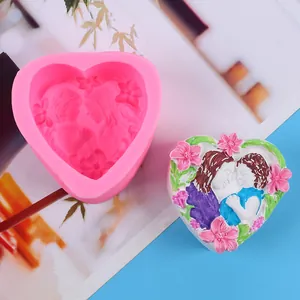 Close-up of heart silicone mold and finished colorful floral relief soap for Valentine's
