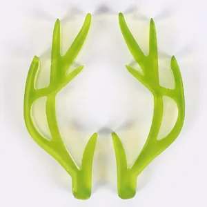 Macro view of a pair of translucent green silicone reindeer antler molds for crafts
