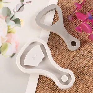 Detail view showing silicone bottle opener mold with a finished resin cast piece