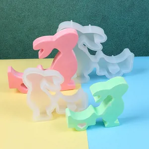 Detailed view of DIY Easter bunny silicone molds with colorful finished resin ornaments