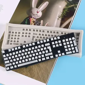 Detail view of a DIY keyboard-shaped silicone mold with finished resin keyboard piece
