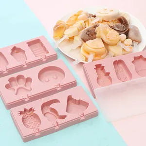 Detailed view of pink silicone ice cream molds featuring cute fruit and animal shapes