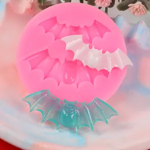 Close-up of pink silicone bat mold for Halloween cake decorating and DIY