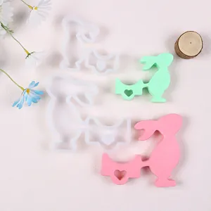 Detailed view of Easter bunny candle holder silicone molds with finished resin casts