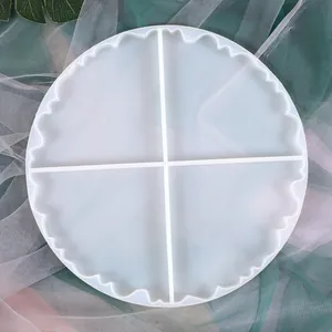 Top view of a 4-grid circular silicone coaster mold with wavy edges for DIY resin craft