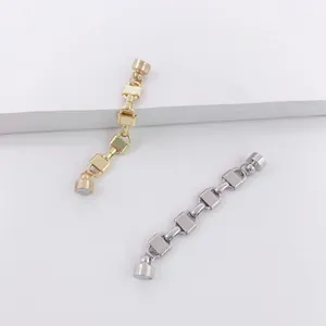 Close-up of gold and silver chain magnetic ear cuffs for non-pierced ears.