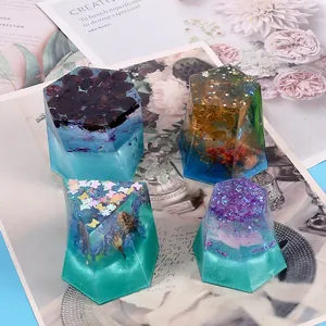 Detailed view of handmade epoxy resin crystals with dried flowers and glitter