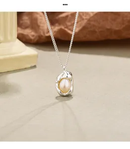 Detailed macro shot of an irregular silver pendant pearl necklace with elegant vintage design