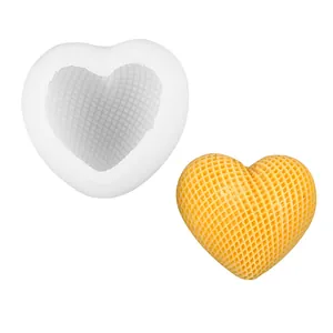 Detail of a heart silicone mold and a yellow textured heart-shaped finished product.