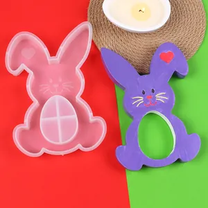 Detailed view of DIY Easter silicone rabbit mold next to a purple hand-painted finished craft piece