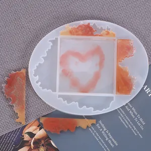 Detailed view of translucent irregular silicone coaster mold showing resin craft process