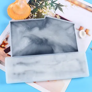 Detail showing marble texture resin inside a DIY sign frame silicone mold