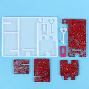 Detailed view of DIY epoxy resin phone stand silicone mold with finished glitter pieces