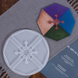 Detailed view of irregular geometric silicone mold and colorful finished resin coaster