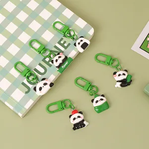 Adorable cartoon panda resin keychains in various cute poses for backpack and bag charms.