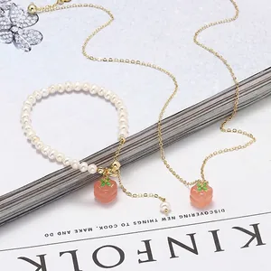 Elegant freshwater pearl bracelet and necklace set with red agate persimmon pendants