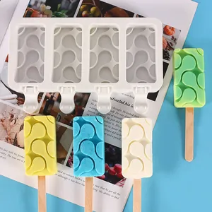 Close-up of a DIY four-cavity silicone popsicle mold showing wave-patterned ice creams