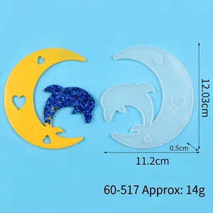 Detailed macro view of moon and dolphin silicone resin mold including clear size measurements