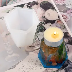 Hexagonal silicone mold for DIY resin candle holder with finished floral specimen example