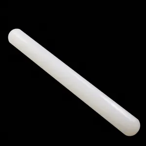 Close-up of a white non-stick plastic rolling pin for professional fondant cake baking