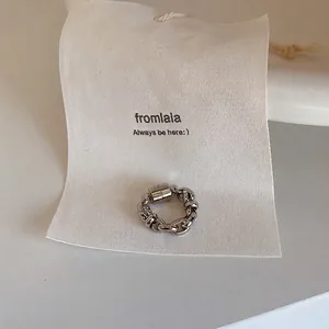 Detailed view of a minimalist silver chain magnetic ear cuff designed for non-pierced ears