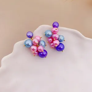 Detailed view showing the colorful freshwater pearl grape cluster stud earrings