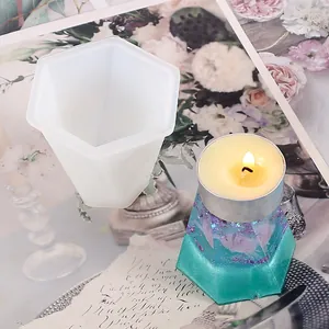 Close-up view of hexagonal silicone mold and a finished resin tealight candle holder
