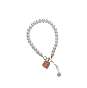 Freshwater pearl necklace with orange agate persimmon pendant for women, white background