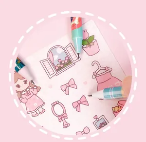 Detailed view of a precision pen-shaped craft knife cutting cute paper illustrations