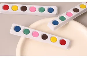 Detailed view of 6-color solid watercolor paint cakes in white strips for DIY painting