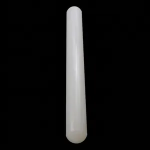Close-up of a white non-stick plastic rolling pin for fondant cake decorating