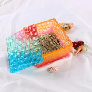 Macro detail of rainbow gradient resin storage box with diamond texture and gold beads