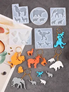 Selection of animal-shaped silicone molds for DIY resin keychains with finished samples