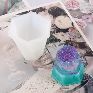 Hexagonal silicone mold shown with a glittery purple and teal epoxy resin finish