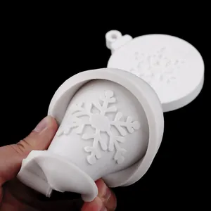 Close-up of flexible white snowflake silicone mold for Christmas DIY baking