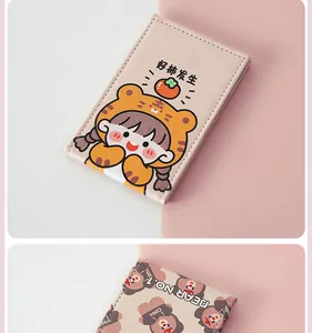 Close-up of portable foldable makeup mirror with cute cartoon girl and bear pattern