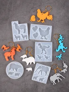 Multiple animal-shaped silicone molds for DIY resin keychains with finished samples