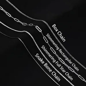 Detail view of four shimmering silver-tone necklaces in various chain styles.