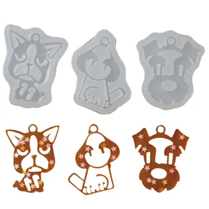 Set of three dog-shaped silicone molds with finished resin pendants