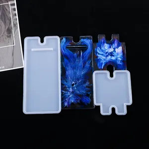 Detailed view of DIY silicone phone stand molds and colorful resin finished pieces