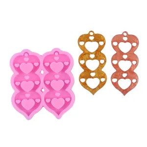 DIY heart tassel earring silicone mold with glitter resin charms on white background