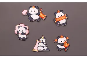 Detailed view of five unique cute panda acrylic fridge magnets with Chinese blessings