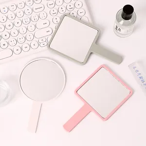 Minimalist handheld makeup mirrors in square and round shapes for portable vanity use