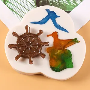 Detailed view of nautical silicone mold featuring ship wheel and seagull resin shapes