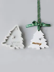 Macro view of a Christmas tree silicone mold and finished fondant ornament with merry text