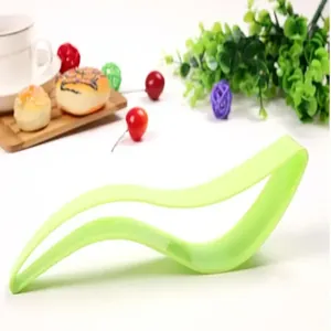 Detail view of light green plastic triangular cake slicer and server tool.