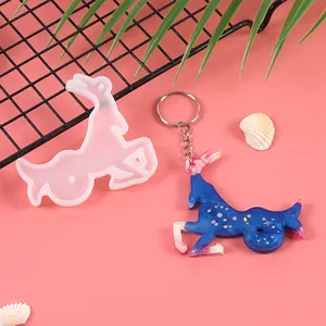 Capricorn constellation silicone resin mold shown with a finished blue starry resin keychain