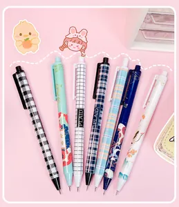Macro detail of various colorful patterned retractable pen-shaped utility knives for crafting