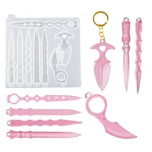 Detailed set of DIY silicone molds and pearlescent pink resin defensive wand keychains