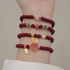 Braccialetti di perle di agata rossa in stile cinese tradizionale con ciondoli d'oro